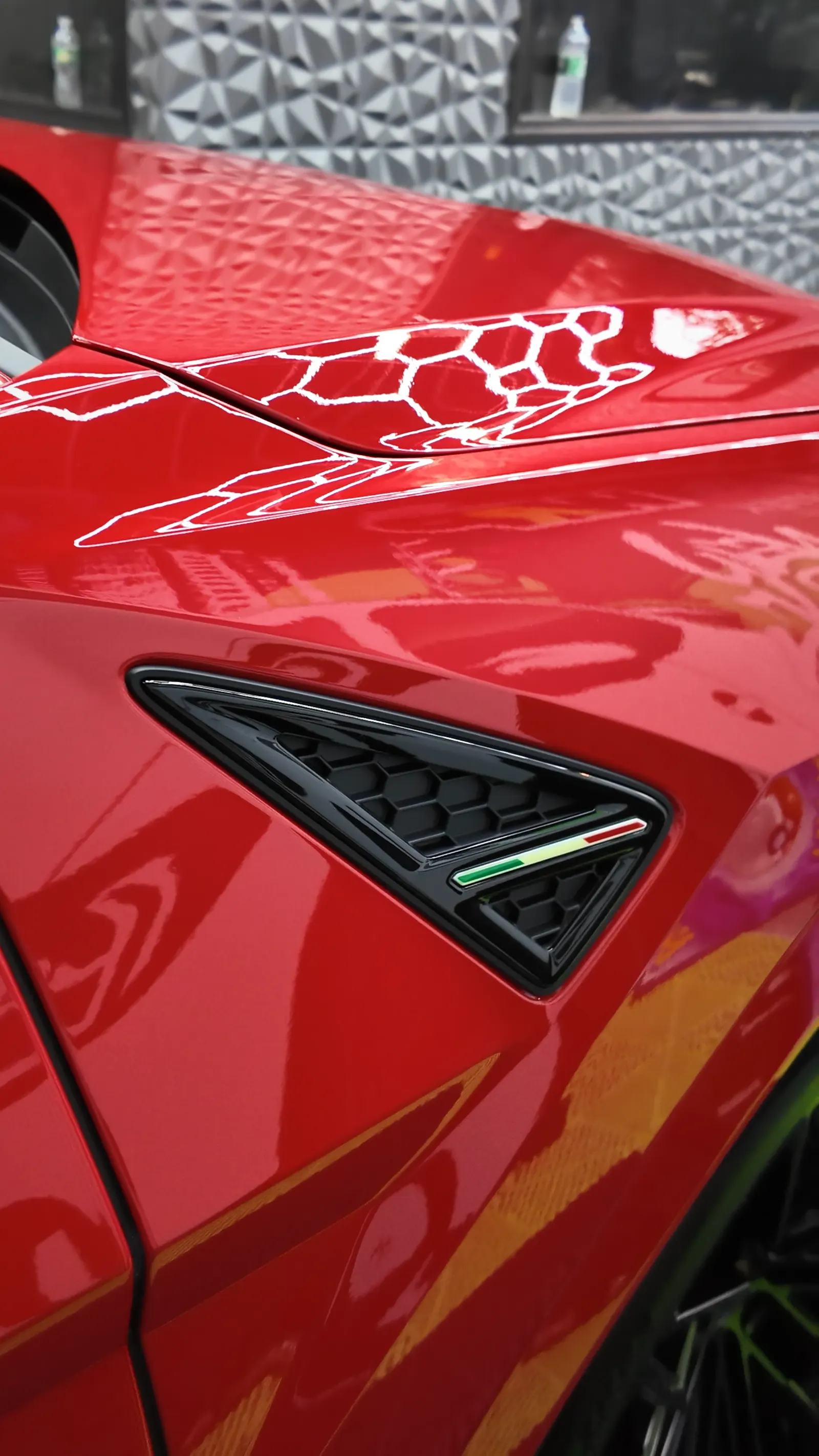 Deep reflections on a ceramic coated Lamborghini Urus fender