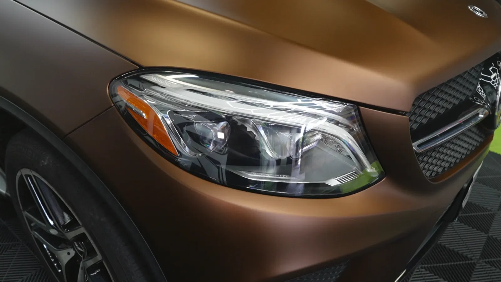 Satin bronze color PPF on a Mercedes-AMG GLE headlight and fender